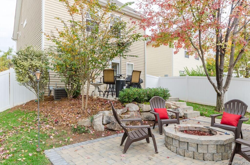 10012 Caldwell Depot Road Cornelius, NC 28031 - Photo 19 of 20 a view of a patio with table and chairs and potted plants