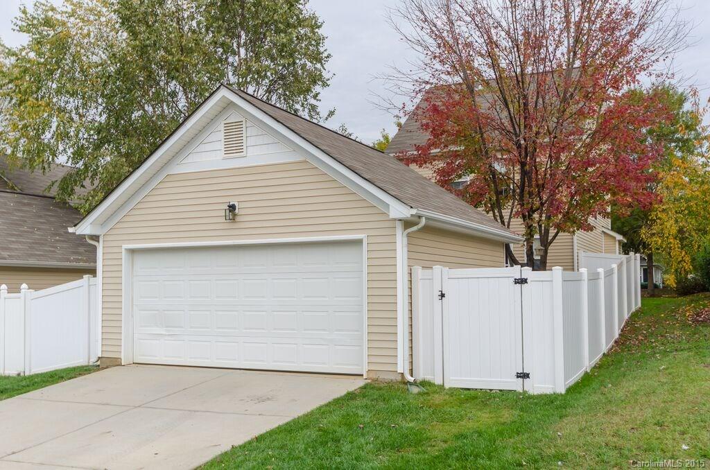10012 Caldwell Depot Road Cornelius, NC 28031 - Photo 20 of 20 a view of backyard of house with wooden fence