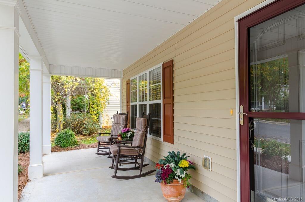 10012 Caldwell Depot Road Cornelius, NC 28031 - Photo 3 of 20 a view of a porch with chairs and potted plants
