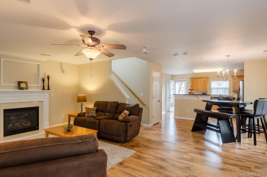 10012 Caldwell Depot Road Cornelius, NC 28031 - Photo 4 of 20 a living room with furniture and a fireplace