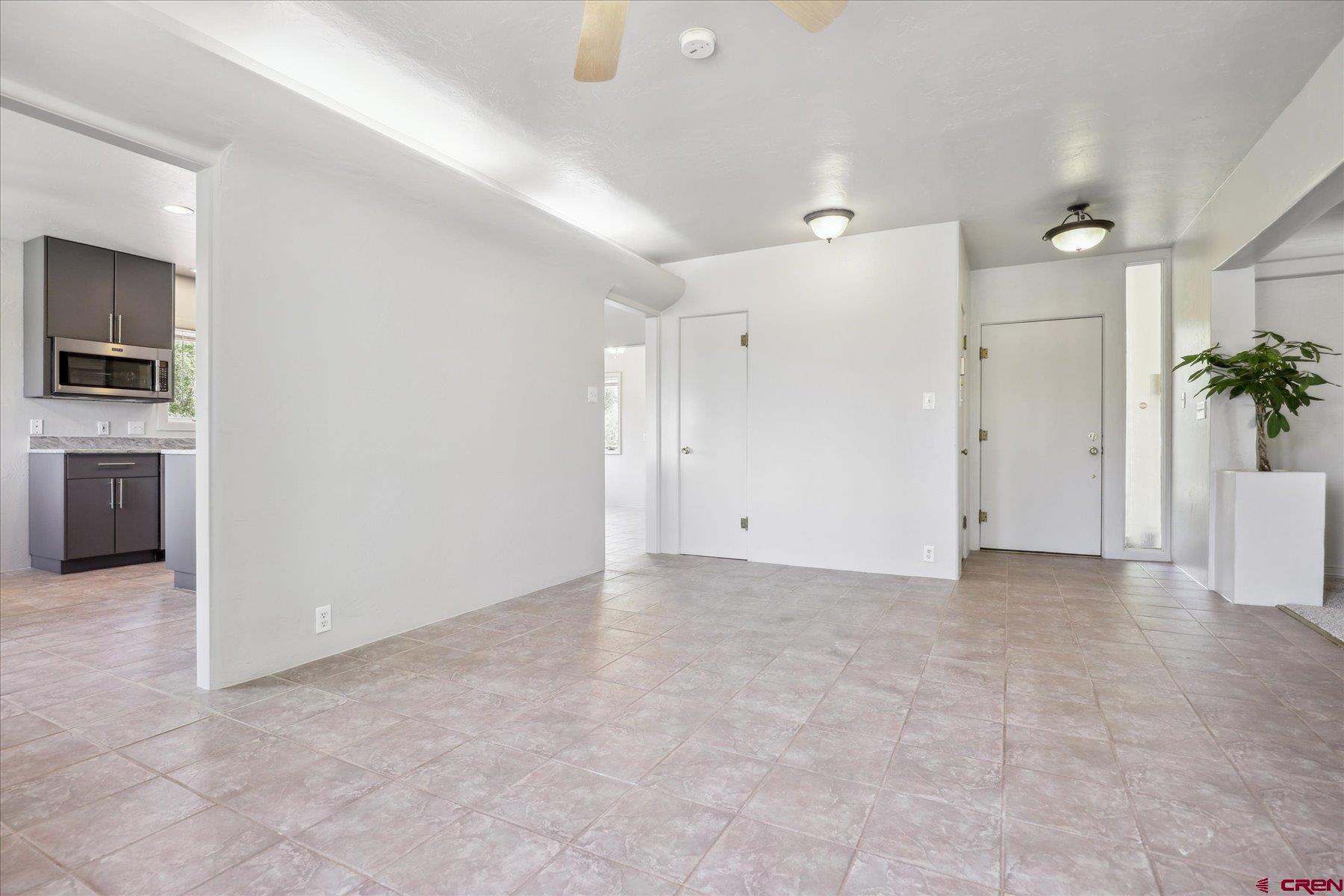 1200 North Dolores Road Cortez, CO 81321 - Photo 11 of 34 a view of a kitchen with a sink and a refrigerator