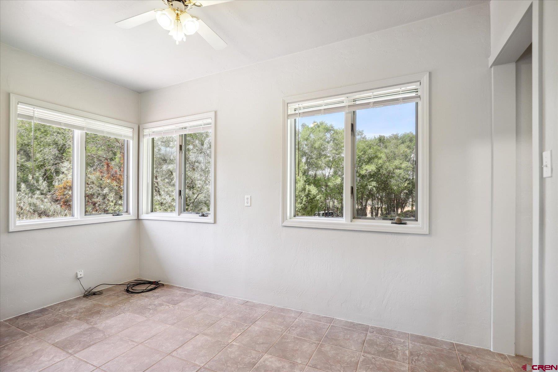 1200 North Dolores Road Cortez, CO 81321 - Photo 25 of 34 a view of an empty room with a window