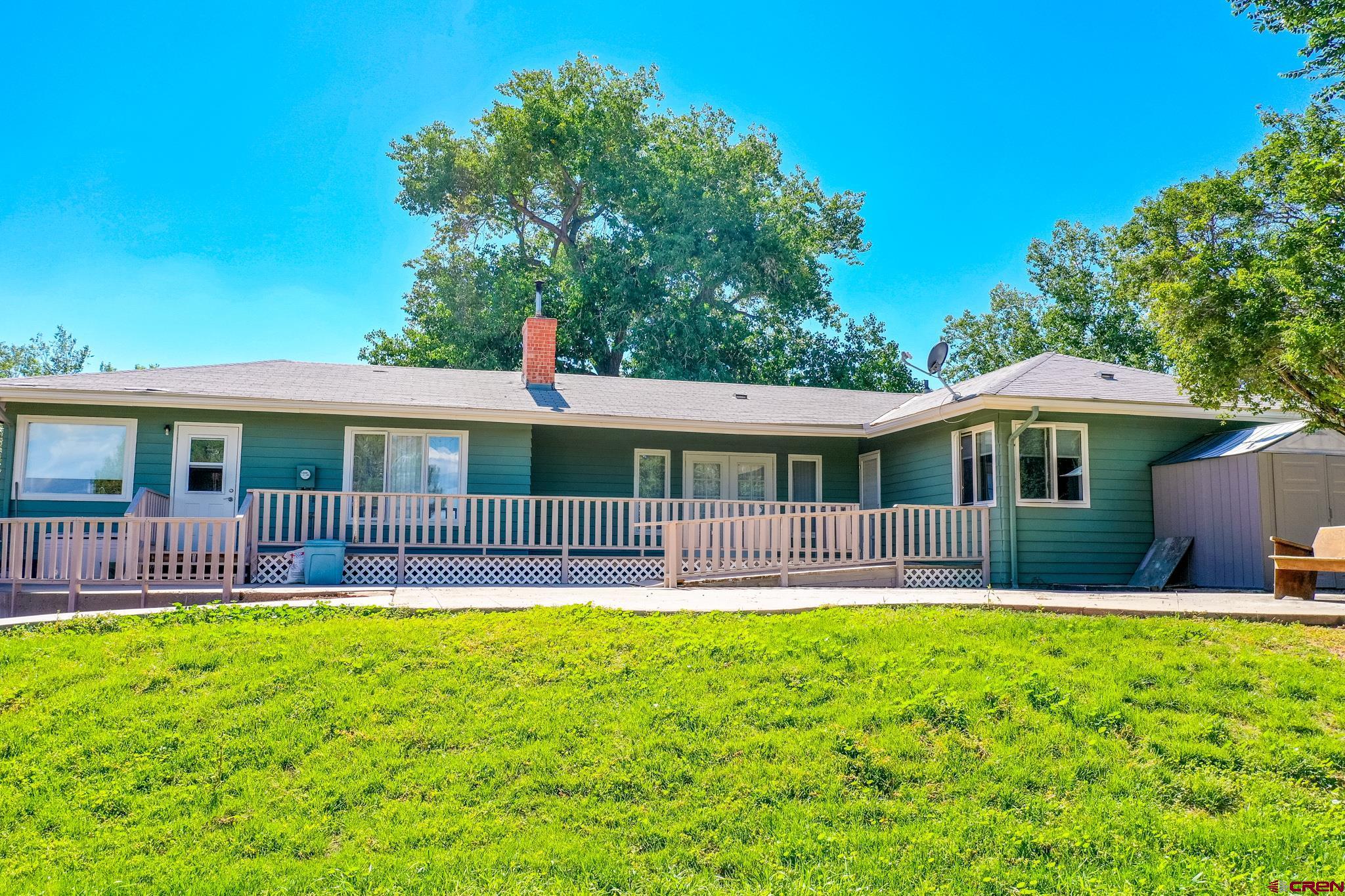 1200 North Dolores Road Cortez, CO 81321 - Photo 33 of 34 a front view of a house with a yard