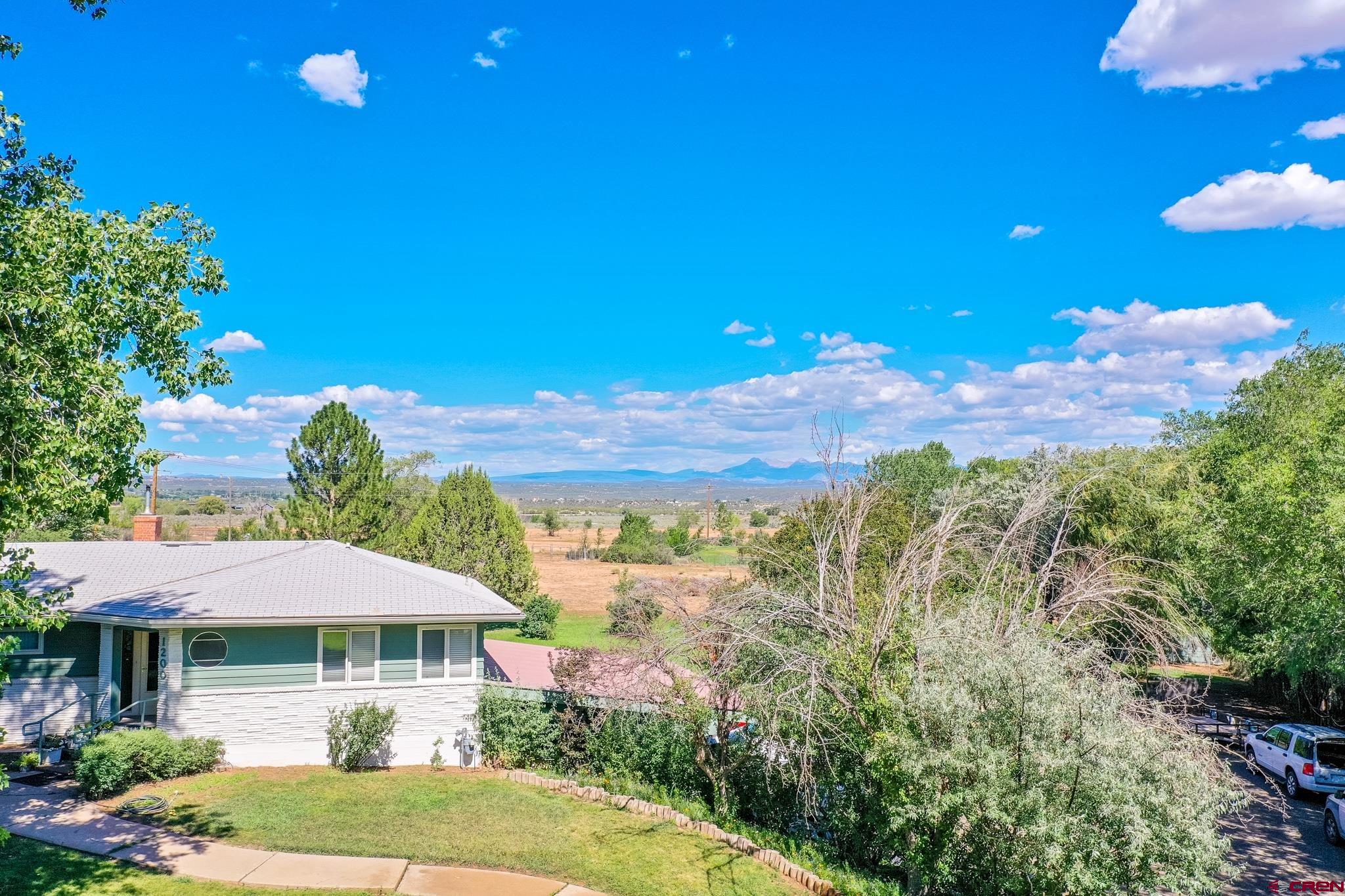 1200 North Dolores Road Cortez, CO 81321 - Photo 7 of 34 a view of a house with a yard