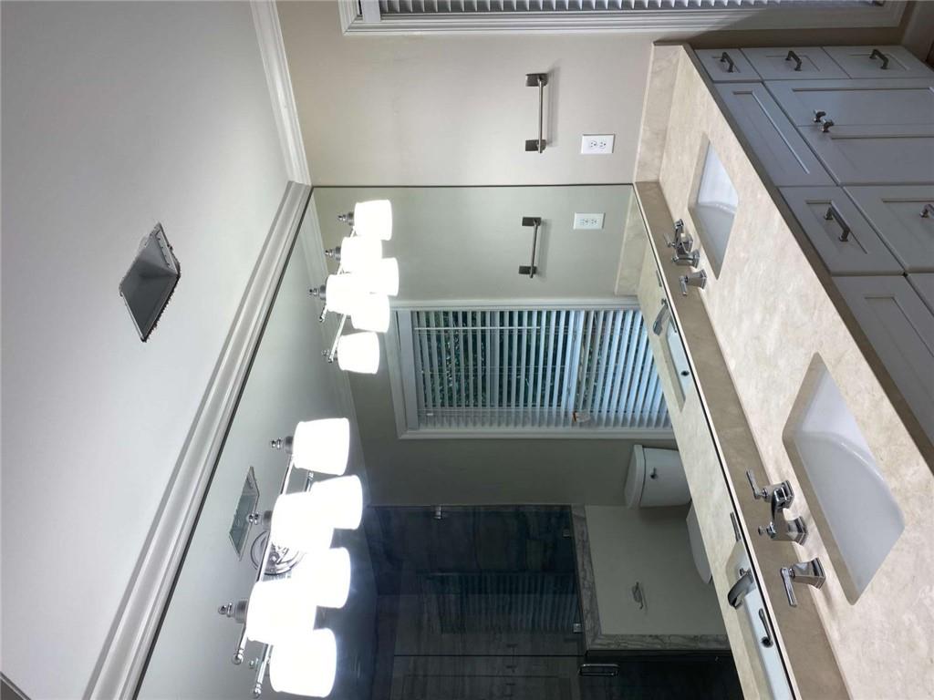 2021 Woodbine Terrace Northeast Atlanta, GA 30329 - Photo 12 of 24 a bathroom with a sink and a mirror