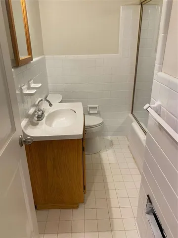 a bathroom with a sink toilet and vanity