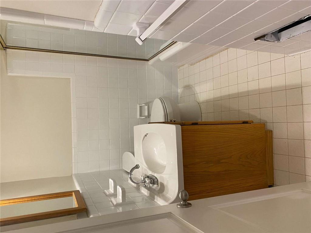 2021 Woodbine Terrace Northeast Atlanta, GA 30329 - Photo 15 of 24 a bathroom with a sink toilet and vanity
