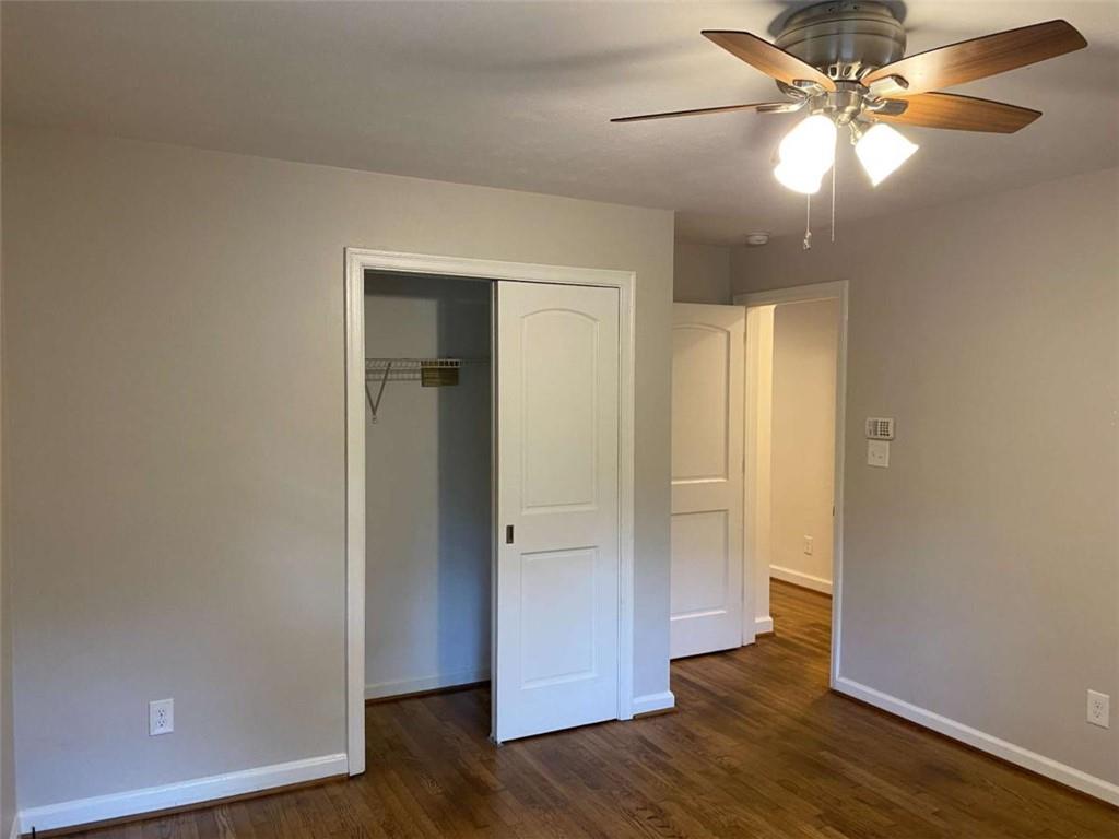 2021 Woodbine Terrace Northeast Atlanta, GA 30329 - Photo 19 of 24 an empty room with wooden floor and a ceiling fan