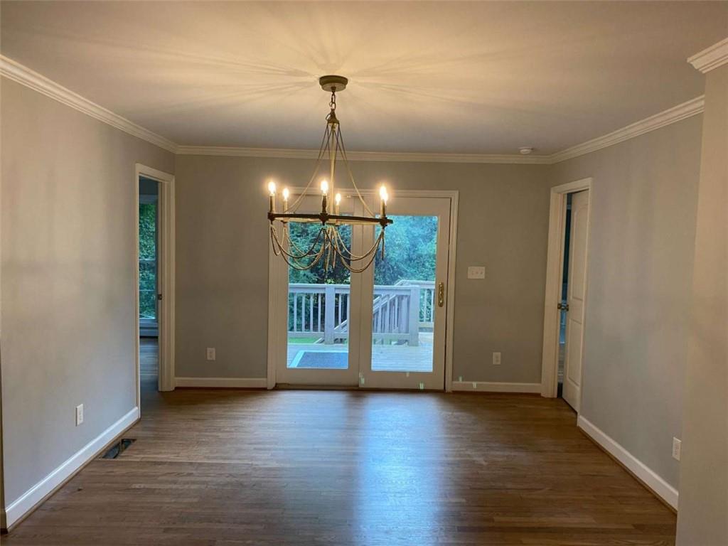 2021 Woodbine Terrace Northeast Atlanta, GA 30329 - Photo 4 of 24 an empty room with wooden floor and a window