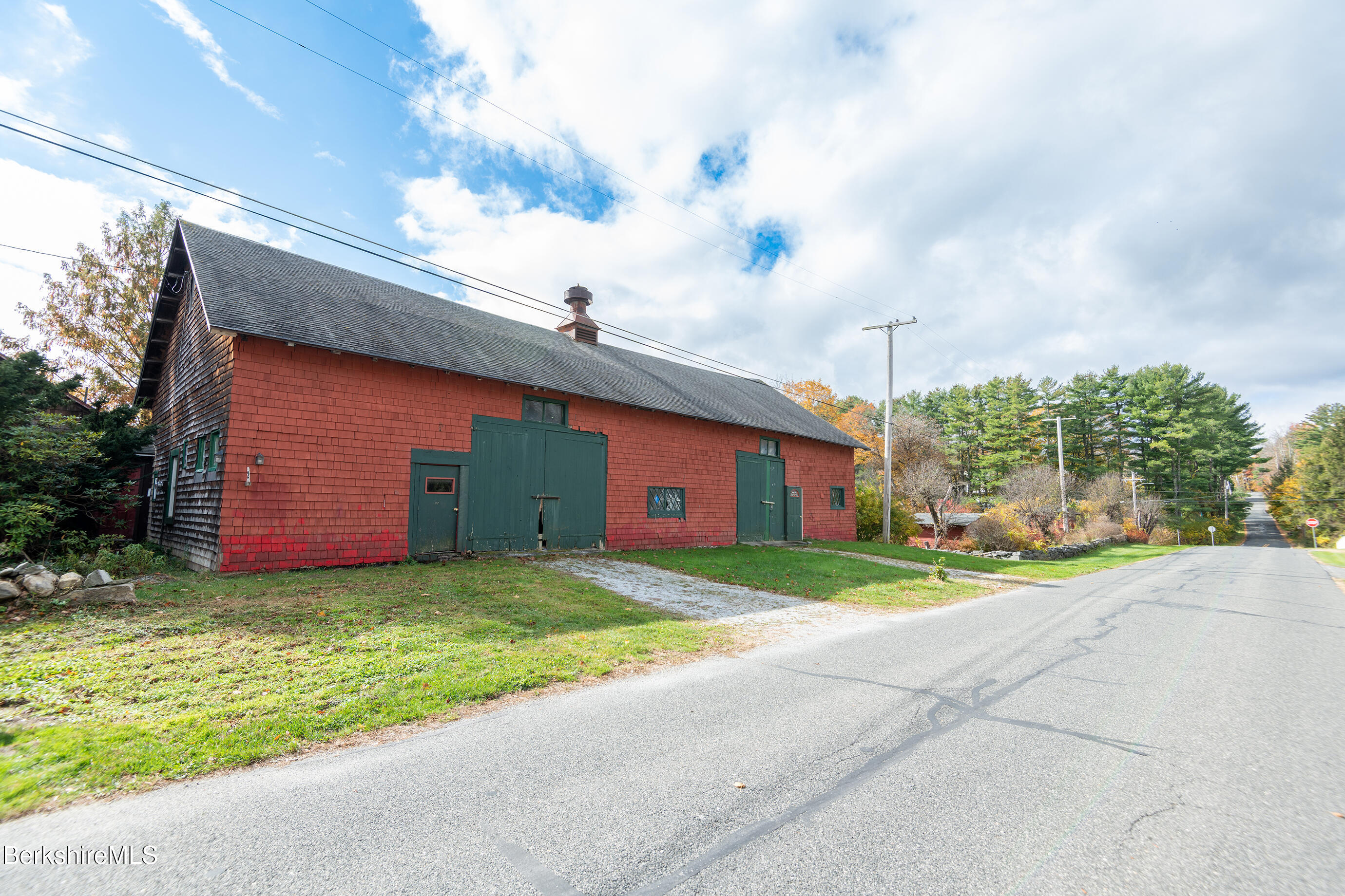 2 Devon Road Stockbridge, MA 01262 - Photo 2 of 12 a view of a house with a yard and garage