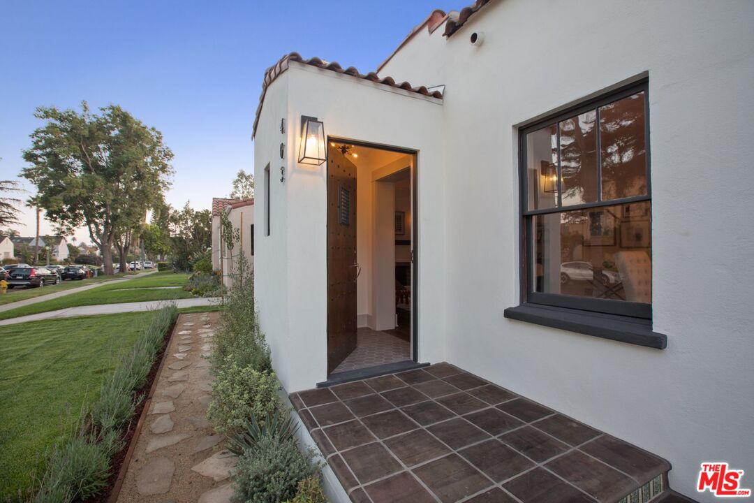 403 North Irving Boulevard Los Angeles, CA 90004 - Photo 2 of 46 a front view of a house with a yard