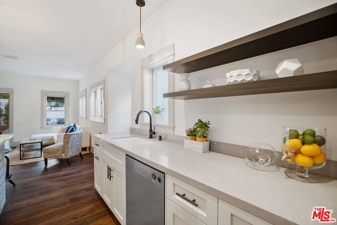 403 North Irving Boulevard Los Angeles, CA 90004 - Photo 13 of 46 a kitchen with a sink and wooden floor
