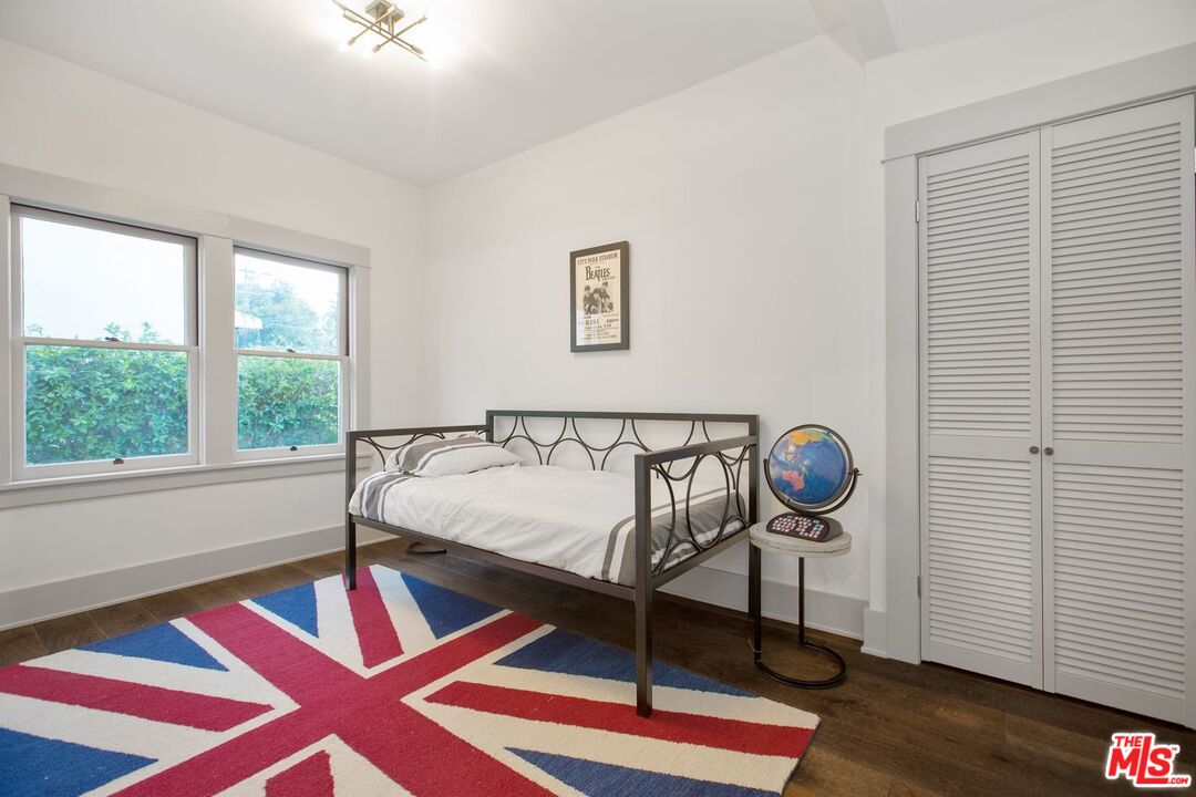 403 North Irving Boulevard Los Angeles, CA 90004 - Photo 21 of 46 a bedroom with a bed and a window