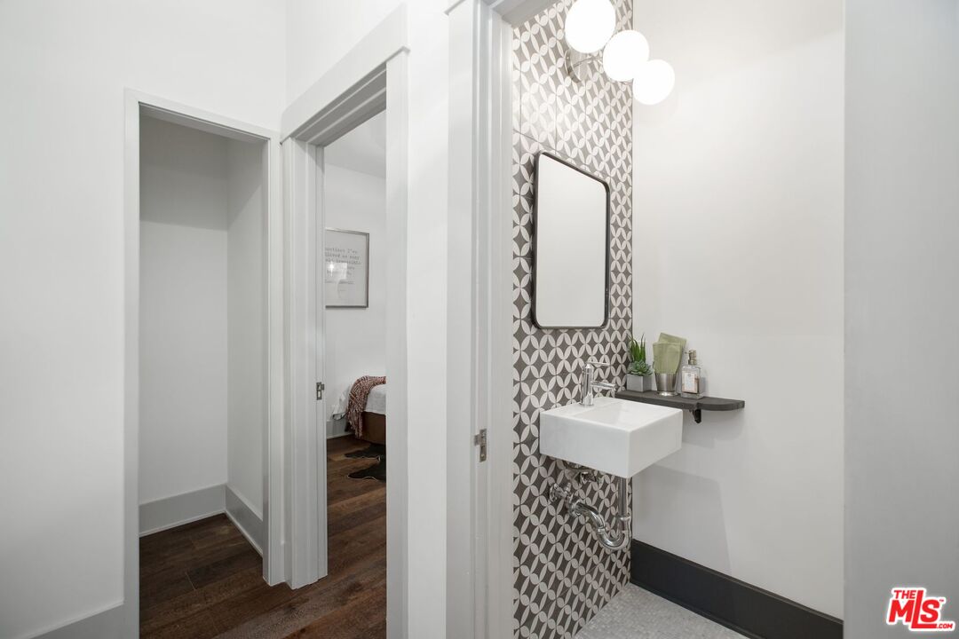 403 North Irving Boulevard Los Angeles, CA 90004 - Photo 23 of 46 a bathroom with a sink and a mirror