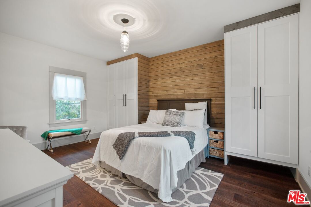 403 North Irving Boulevard Los Angeles, CA 90004 - Photo 27 of 46 a bedroom with a bed and a window