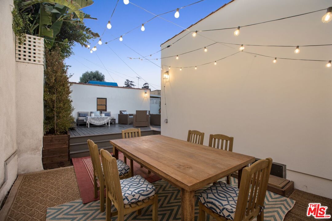403 North Irving Boulevard Los Angeles, CA 90004 - Photo 34 of 46 a view of a dining room with furniture and a chandelier
