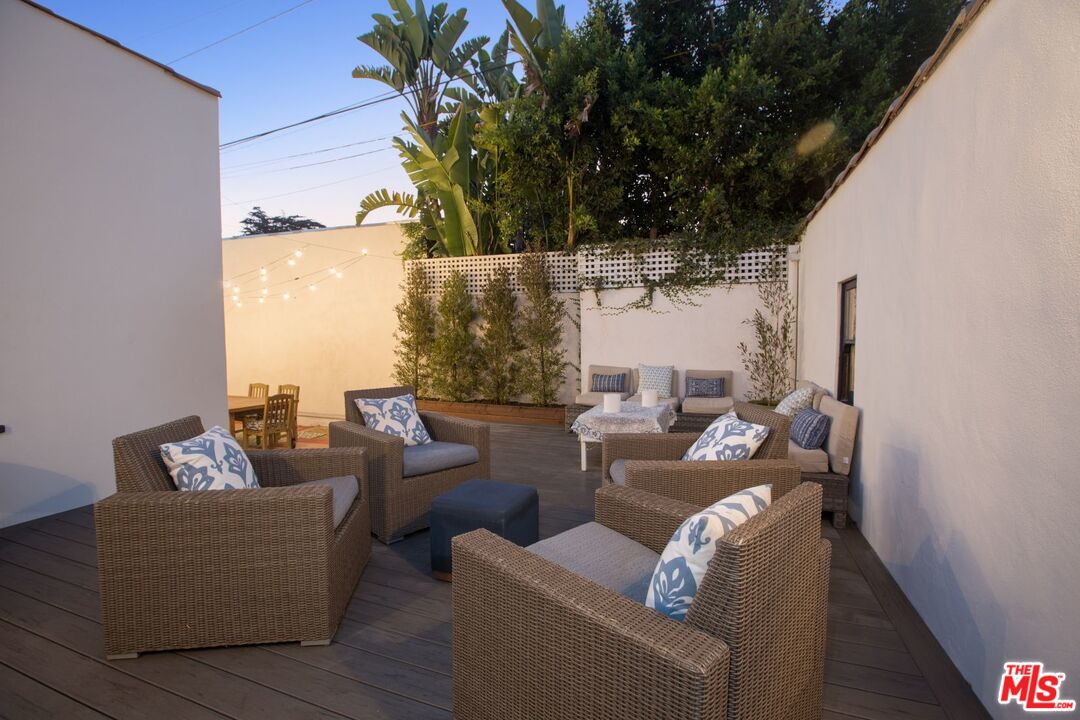 403 North Irving Boulevard Los Angeles, CA 90004 - Photo 38 of 46 a outdoor living room with patio furniture and a potted plant