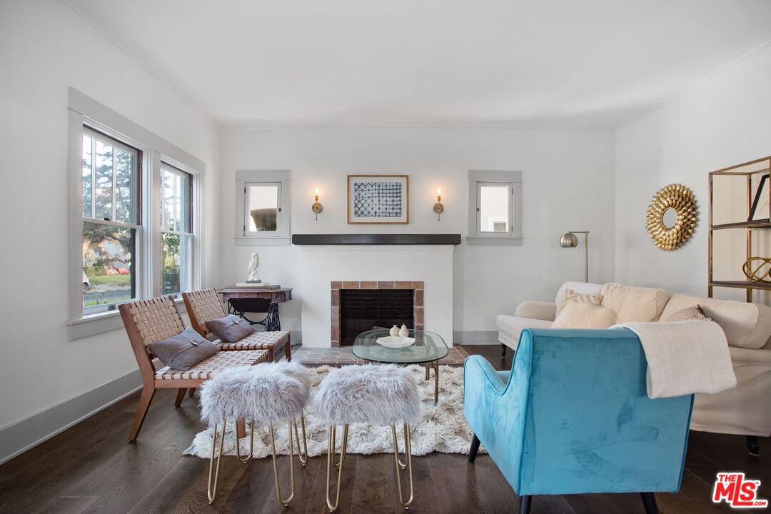 403 North Irving Boulevard Los Angeles, CA 90004 - Photo 6 of 46 a living room with furniture and a fireplace