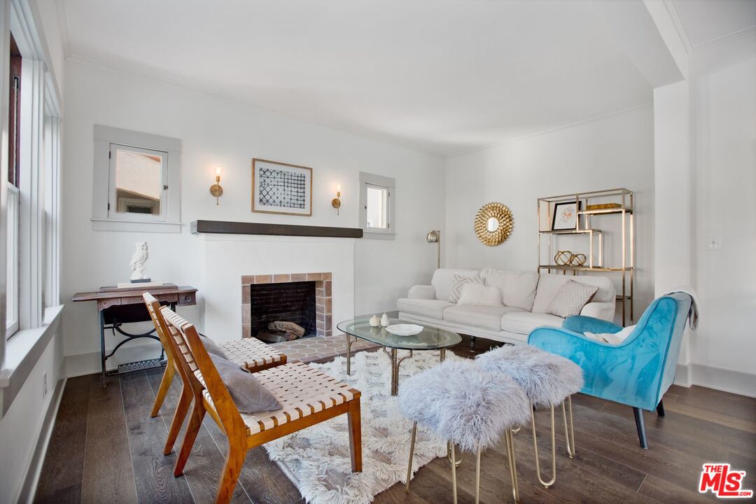 403 North Irving Boulevard Los Angeles, CA 90004 - Photo 7 of 46 a living room with furniture and a fireplace