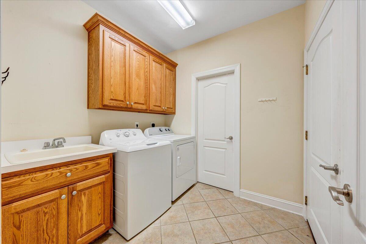 625 Frontier Way Fincastle, VA 24090 - Photo 45 of 105 a utility room with a sink a washer and dryer