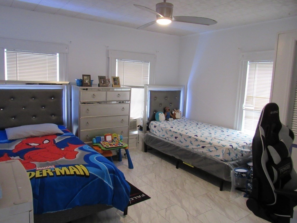 1-3 Walnut Street Methuen, MA 01844 - Photo 12 of 20 a bedroom with a bed and a dresser