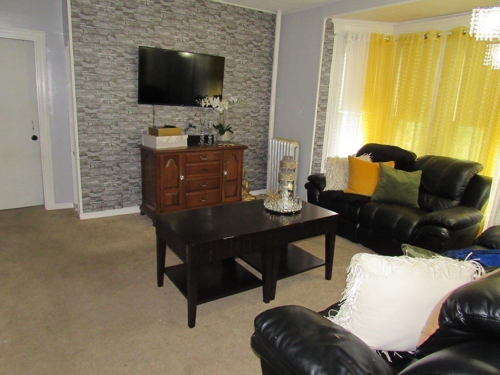 1-3 Walnut Street Methuen, MA 01844 - Photo 15 of 20 a living room with furniture and a flat screen tv