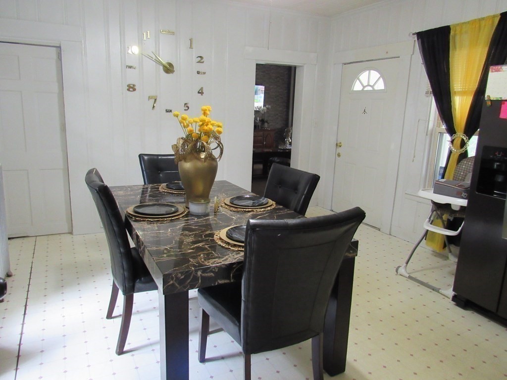 1-3 Walnut Street Methuen, MA 01844 - Photo 17 of 20 a view of a dining room with furniture and a potted plant