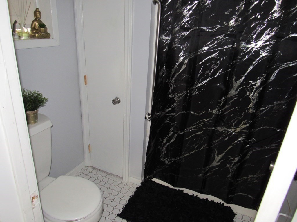 1-3 Walnut Street Methuen, MA 01844 - Photo 19 of 20 a bathroom with a toilet and a shower
