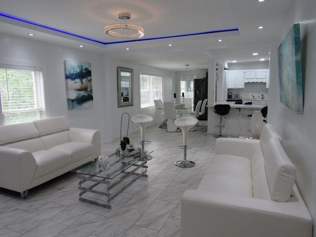 1-3 Walnut Street Methuen, MA 01844 - Photo 3 of 20 a living room with furniture and a large window