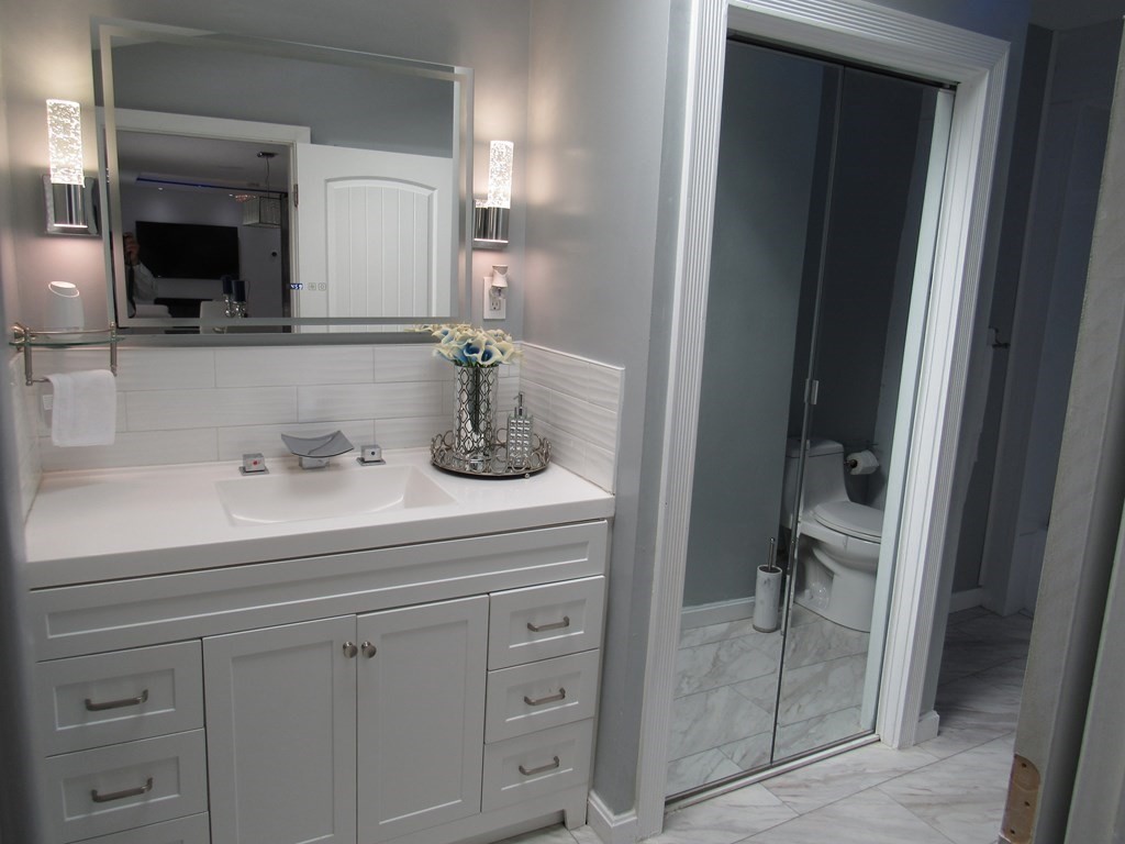 1-3 Walnut Street Methuen, MA 01844 - Photo 7 of 20 a bathroom with a sink and a mirror