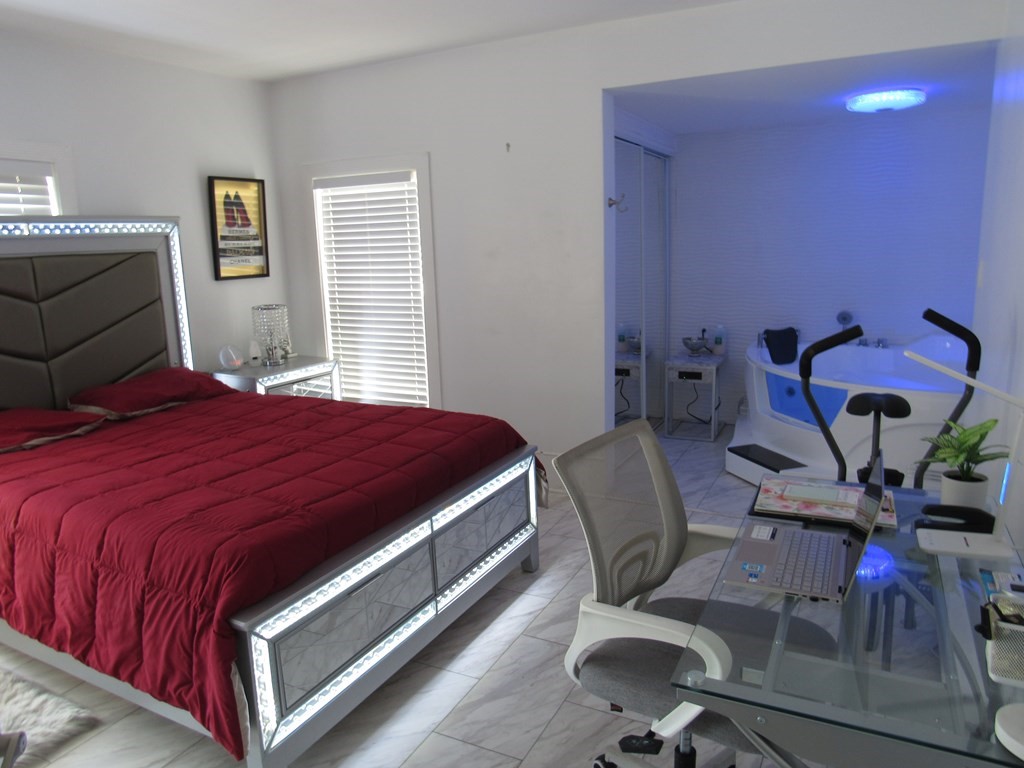 1-3 Walnut Street Methuen, MA 01844 - Photo 10 of 20 a bedroom with a bed and chair