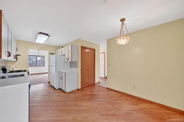 a view of kitchen with wooden floor
