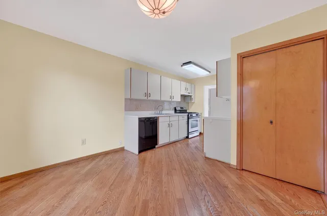 a kitchen with a table and chairs