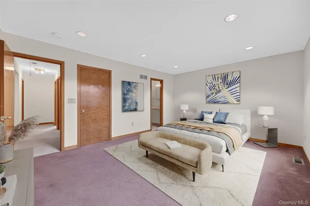 an empty room with closet and a bathroom