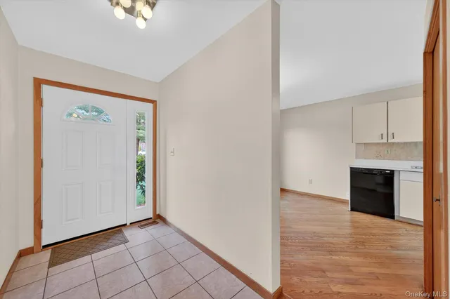 a view of an empty room with a fireplace