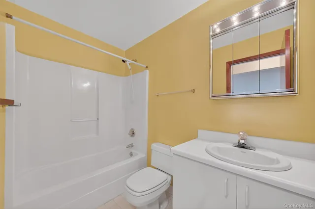 a view of an empty room with a fireplace