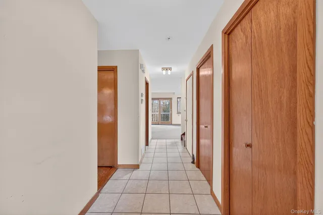a view of empty room with a fireplace