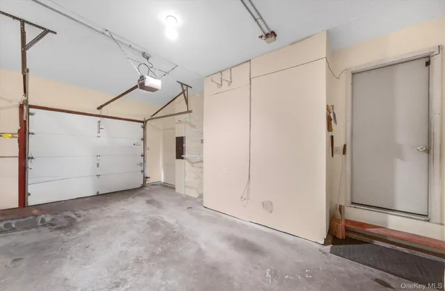 a view of a house with a yard and pathway