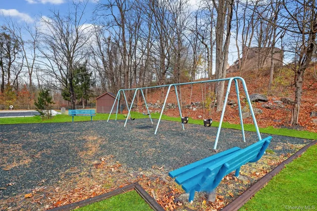 a view of a backyard with a bench