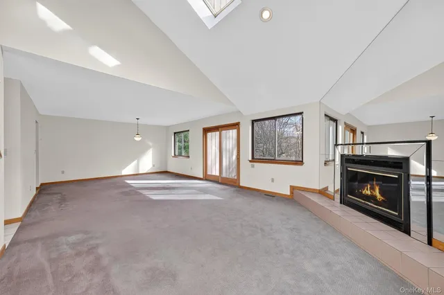 a living room with fireplace furniture and a fireplace