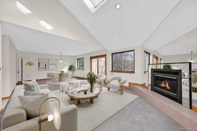 a view of empty room with fireplace