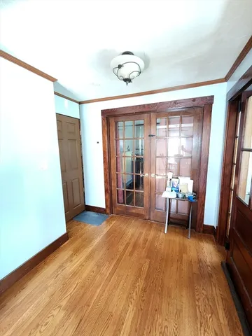 a view of a livingroom with furniture and a floor to ceiling window