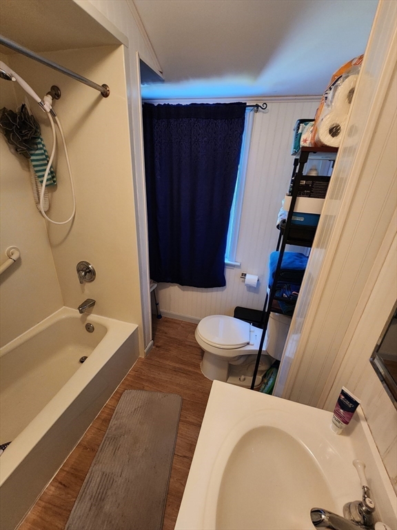 17 Davis Street Taunton, MA 02780 - Photo 25 of 26 a bathroom with a sink and a bathtub