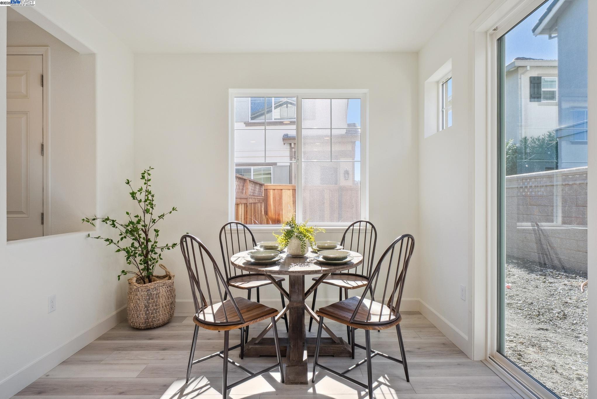 246 Mindy Way Pittsburg, CA 94565 - Photo 13 of 38 a view of a dining room with furniture and wooden floor