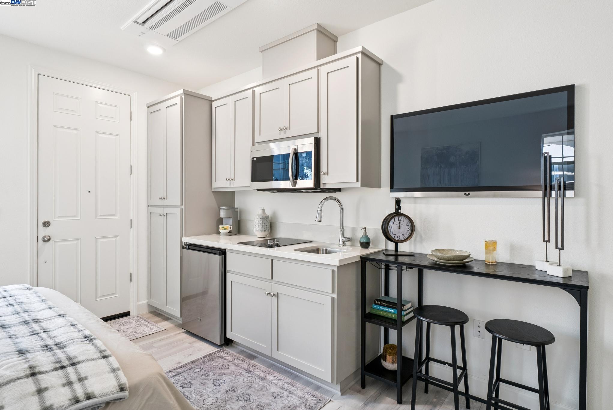 246 Mindy Way Pittsburg, CA 94565 - Photo 18 of 38 a kitchen with stainless steel appliances a stove a sink and a microwave
