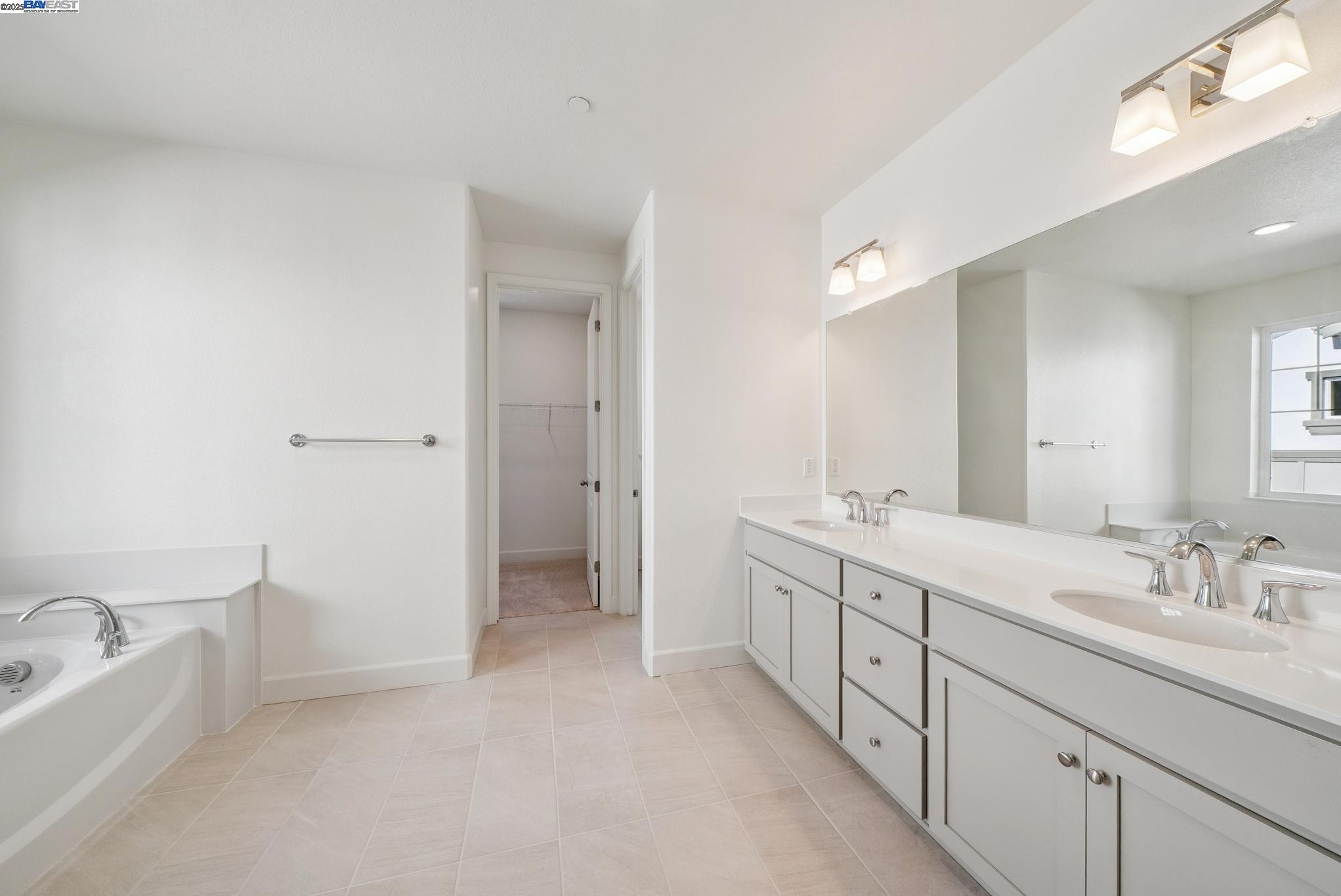 246 Mindy Way Pittsburg, CA 94565 - Photo 25 of 38 a spacious bathroom with a double vanity sink mirror double and bathtub