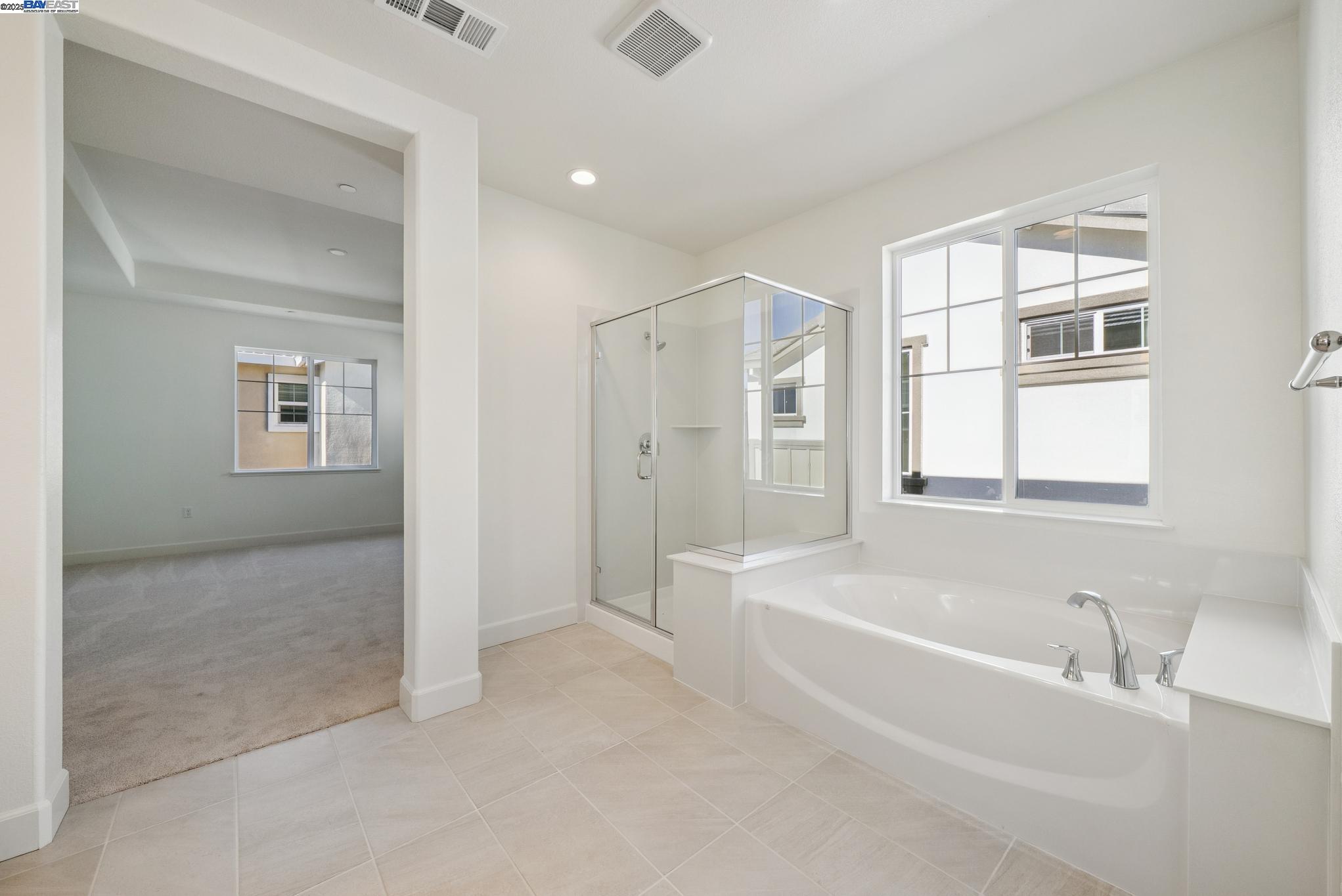 246 Mindy Way Pittsburg, CA 94565 - Photo 26 of 38 a spacious bathroom with a bathtub and a shower