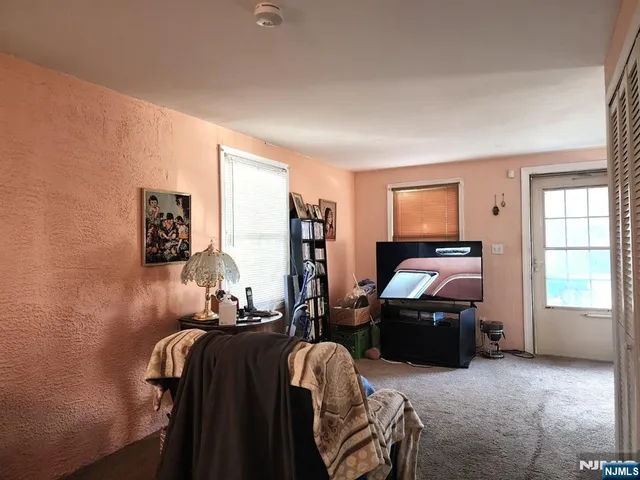 a bed room with bed and windows