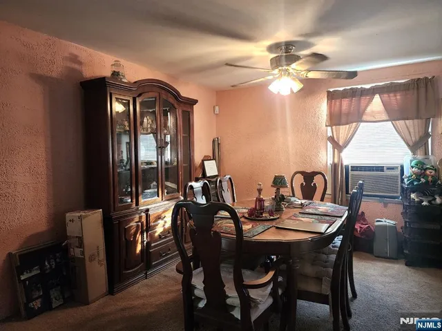 a view of a dining room with furniture and window