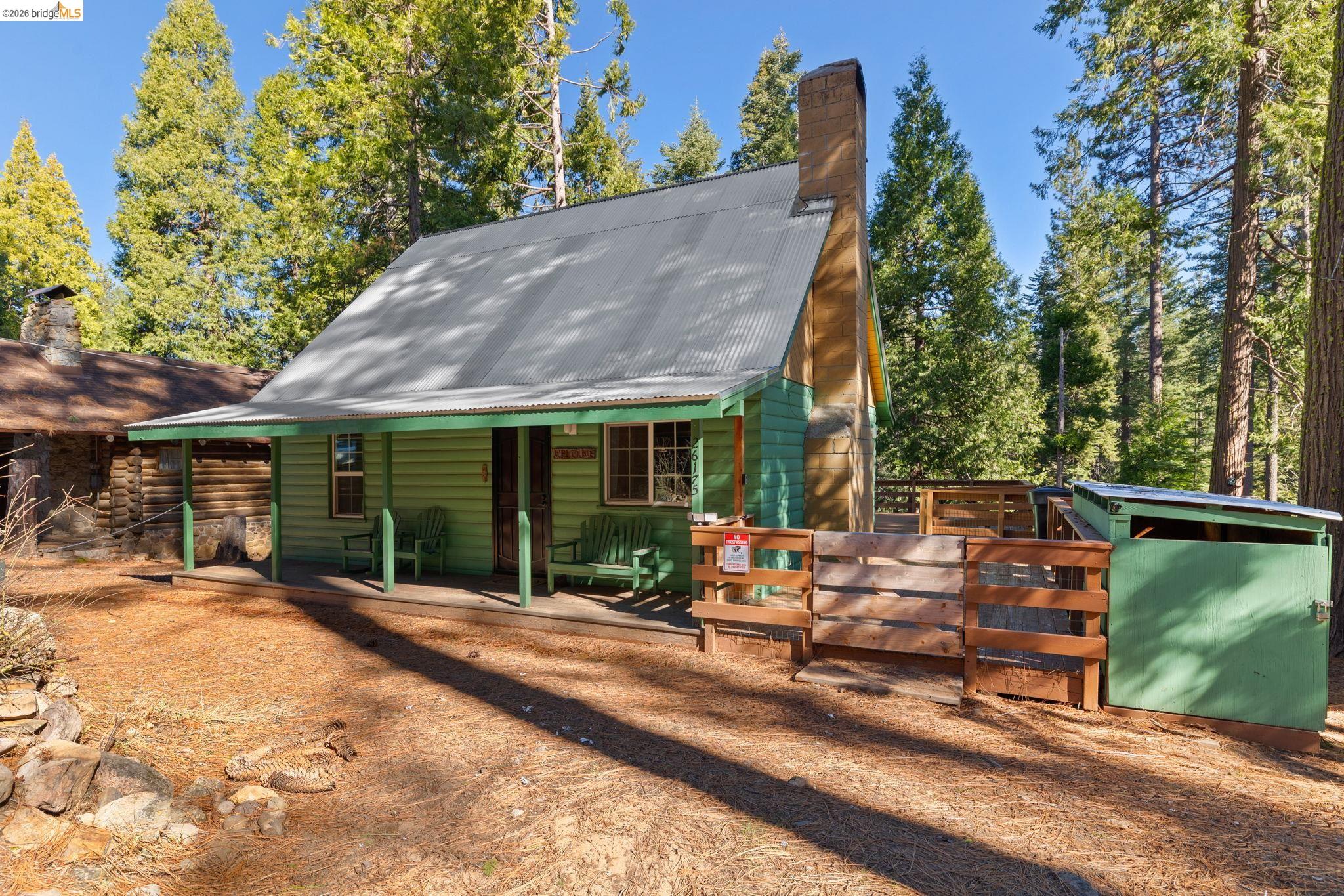 26175 Janice Way Long Barn, CA 95335 - Photo 1 of 23 Exterior space with a metal roof, a chimney, and a wooden deck